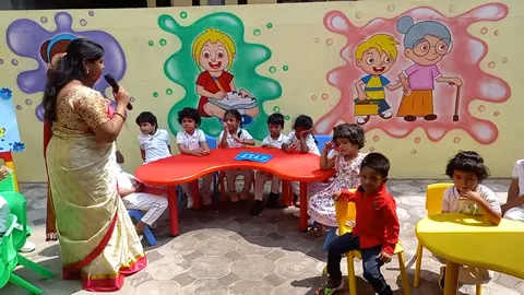 Outdoor classroom circle with a teacher leading an activity