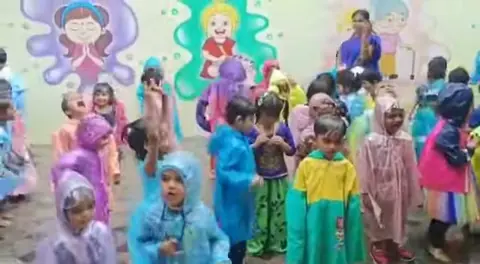 Rainy Day Celebration, children in raincoats